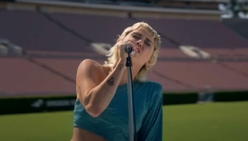 Miley Cyrus Covers The Beatles’ “Help!” in Empty Rose Bowl Stadium: Watch