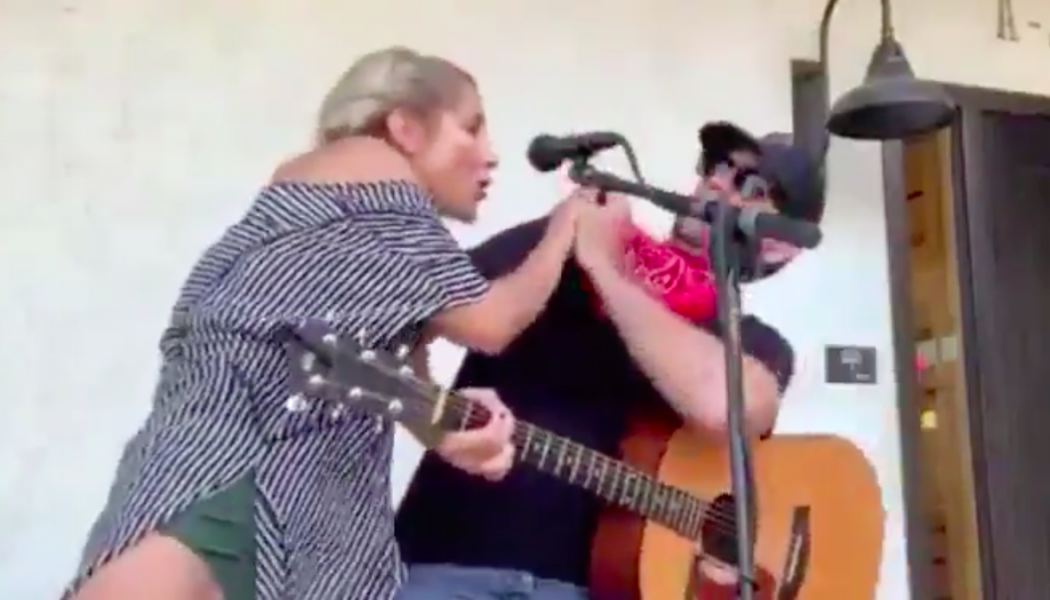 Woman Jumps on Stage, Coughs on Singer Clayton Gardner During Concert