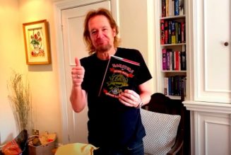 IRON MAIDEN’s ADRIAN SMITH Unboxes First Copy Of His Upcoming Fishing Memoir ‘Monsters Of River & Rock’