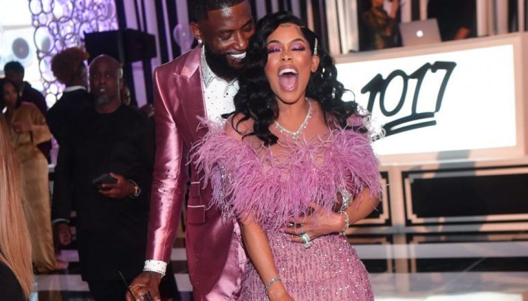 Keyshia Ka’Oir Blesses Gucci Mane With Ridiculously Large Chain To Remind Him He Is Ice’s Dad