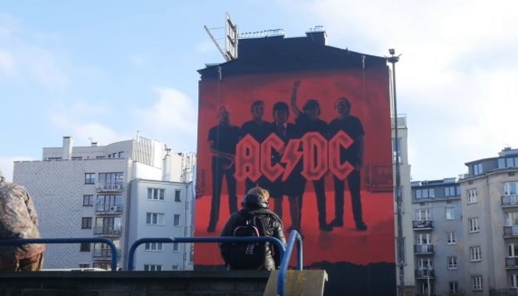 Watch Massive AC/DC ‘Power Up’ Mural Being Painted In Warsaw, Poland