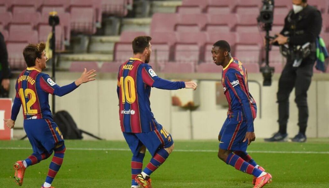 Barcelona scrape to a narrow win against 10-man Real Valladolid to go within a point of the top