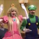 Grimes Plays Princess Peach to Elon Musk’s Wario on Super Mario Themed SNL Skit