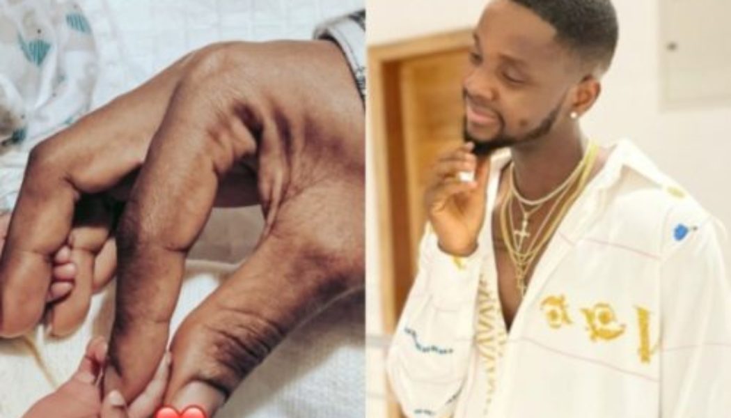 Kizz Daniel shows off his twin babies on his birthday