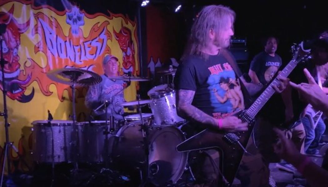 EXODUS, MACHINE HEAD, HIRAX Members Perform ‘A Lesson In Violence’ At TOM HUNTING Benefit Concert (Video)