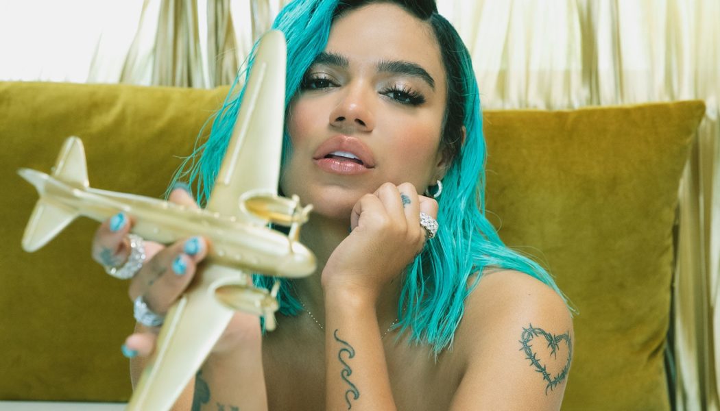 Watch Karol G Get Inked With Friends in ‘200 Copas’ Video