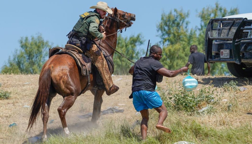 Photos of Border Patrol Agent Using Whips On Haitian Migrant Stokes Outrage