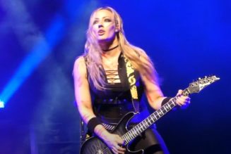 NITA STRAUSS Gets Hit In Head By Flying Broken Cane Piece During ALICE COOPER Concert (Video)