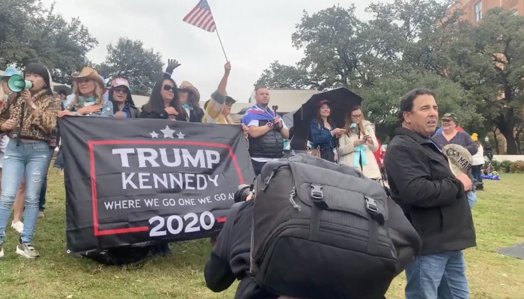 QAnon Believers, Still Waiting in Dallas, Sing “Take Me Home, Country Roads” to JFK Jr.: Watch