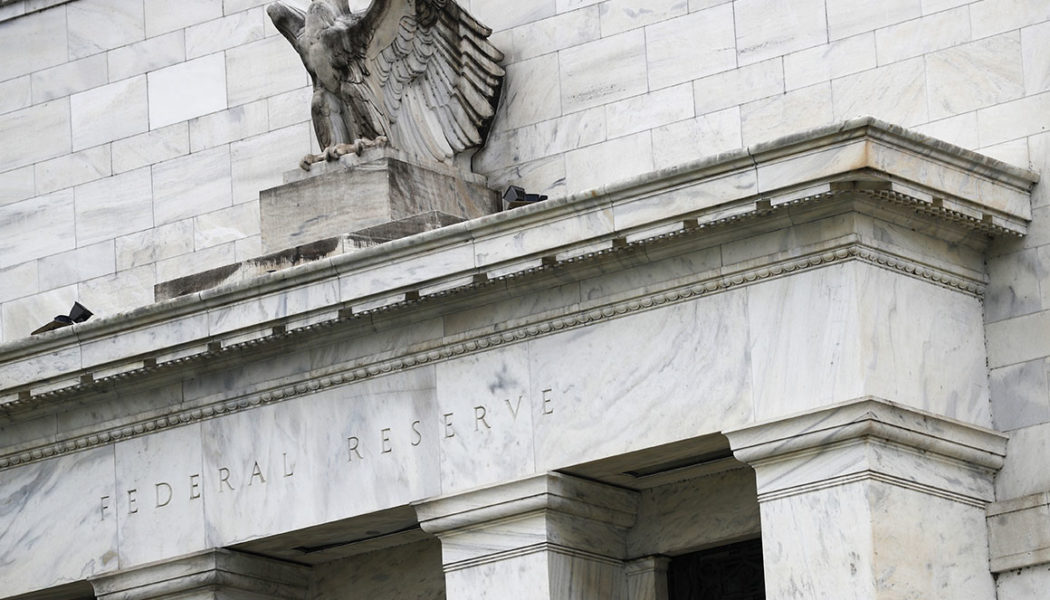 The Fed is ready to rein in its aid. Market tremors are already emerging.