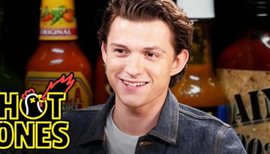 Tom Holland Takes Double Bites of the Spiciest Wings on ‘Hot Ones’