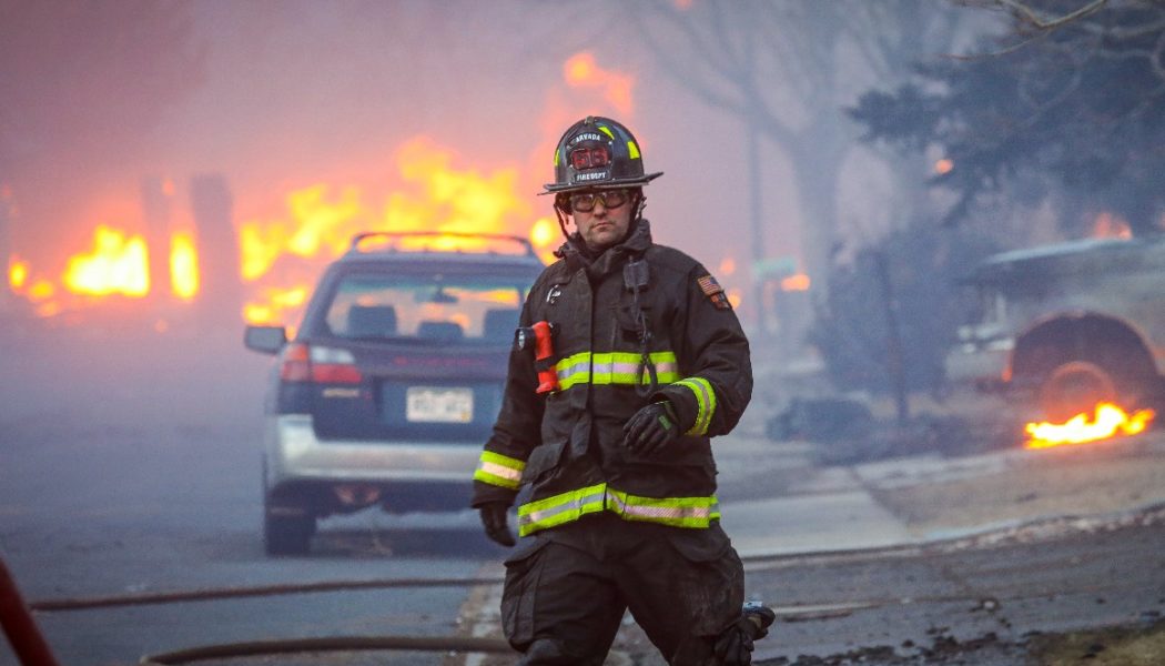 Wildfires burn hundreds of homes in Colorado, thousands flee