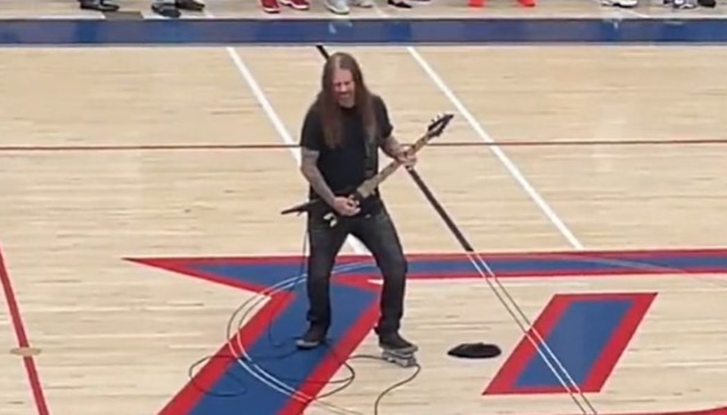 Former MACHINE HEAD Guitarist PHIL DEMMEL Plays U.S. National Anthem At DUBLIN GAELS Basketball Game (Video)