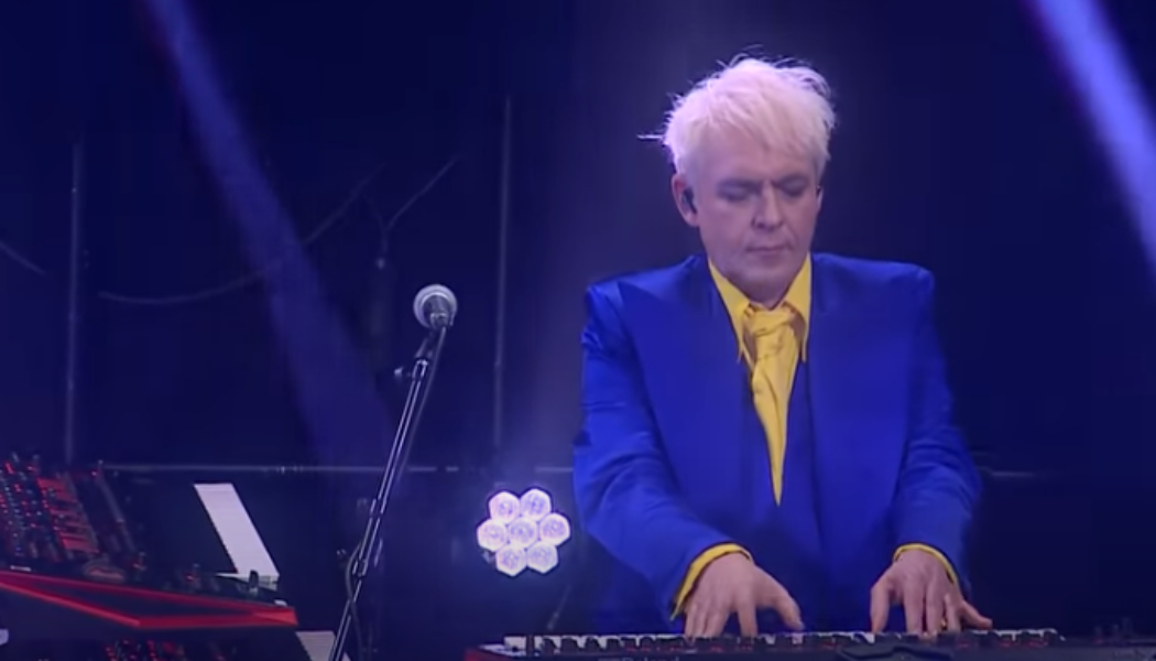 Duran Duran’s Nick Rhodes Steals the Show Wearing Ukraine’s Colors on Corden