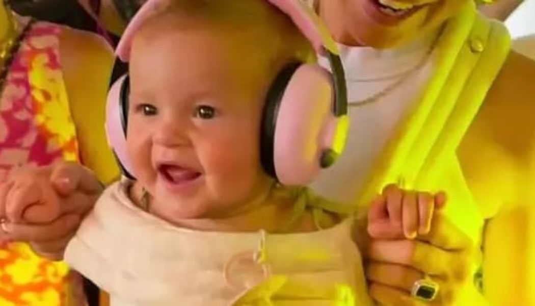 Watch FISHER Play Peek-a-Boo With His Baby Goddaughter at a Rave In France