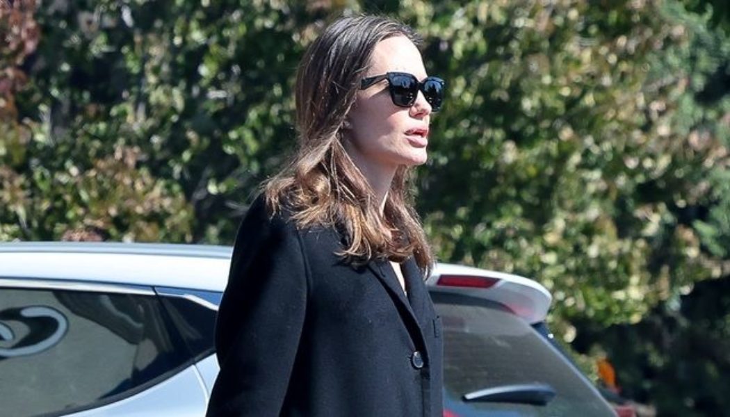 Angelina Jolie Just Styled Puddle Pants With Autumn’s Top Coat Trend