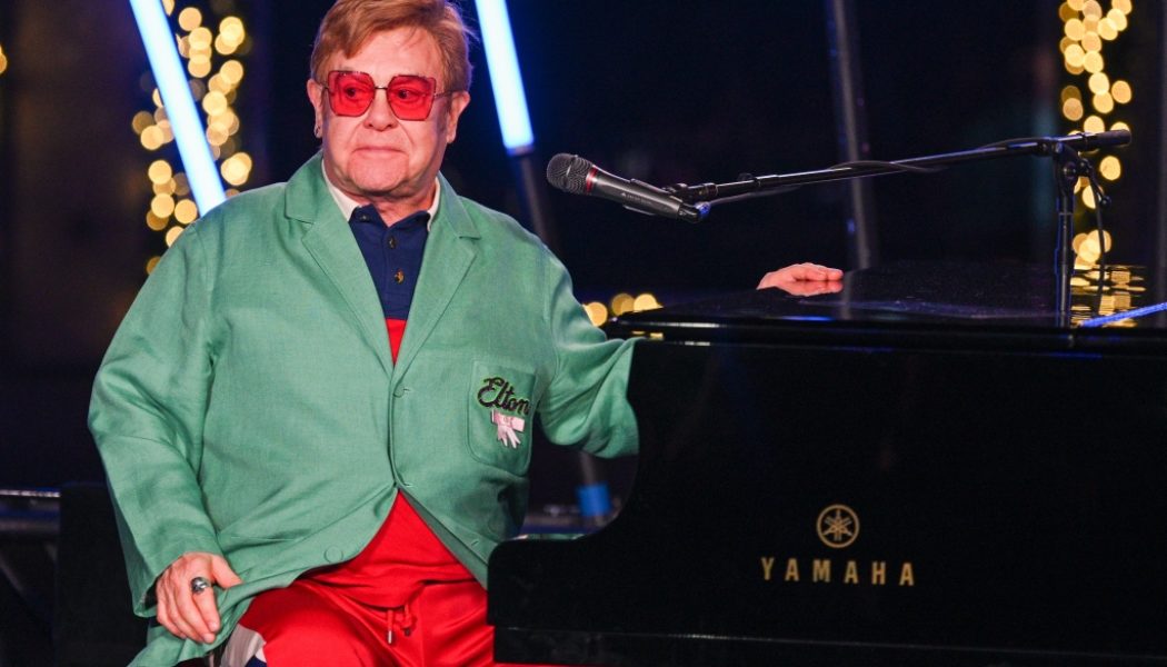 Elton John & His Family Ring In the Holidays With Saks Fifth Avenue Window Reveal