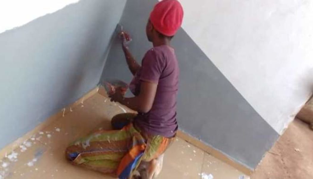 PHOTOS: LASPOTECH Student Goes Viral After Spotted Painting Building As Side Hussle Instead Of Urgent 2k