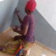 PHOTOS: LASPOTECH Student Goes Viral After Spotted Painting Building As Side Hussle Instead Of Urgent 2k