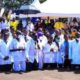 Ugandan doctors kneel to appeal to President Museveni, 78, to contest for the 7th time