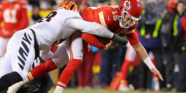 Joseph Ossai of the Cincinnati Bengals, tackles Patrick Mahomes of the Chiefs during the AFC Championship Game at GEHA Field at Arrowhead Stadium on Jan. 29, 2023, in Kansas City, Missouri.