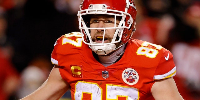 Travis Kelce, #87 of the Kansas City Chiefs, celebrates after catching a pass for a touchdown against the Cincinnati Bengals during the second quarter in the AFC Championship Game at GEHA Field at Arrowhead Stadium on Jan. 29, 2023 in Kansas City, Missouri.