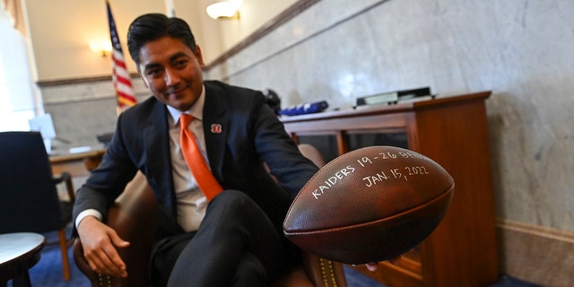 Cincinnati Mayor Aftab Pureval holds the Bengals winning game ball form their playoff game with the Las Vegas Raiders during an interview in his office on Feb. 7, 2022 in Cincinnati.