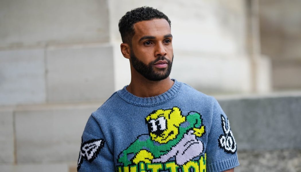 “Emily in Paris”‘s Lucien Laviscount Rocks a Pleated Skirt at Louis Vuitton Show