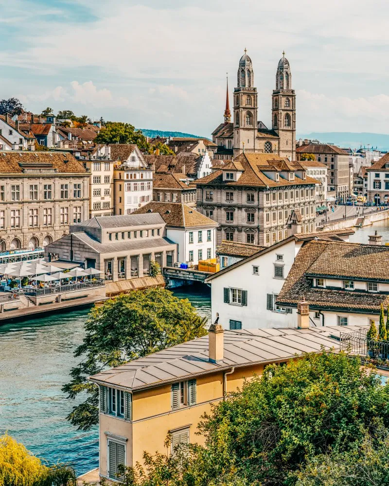 View over river in Züric towards Grossmünster — Getty Images