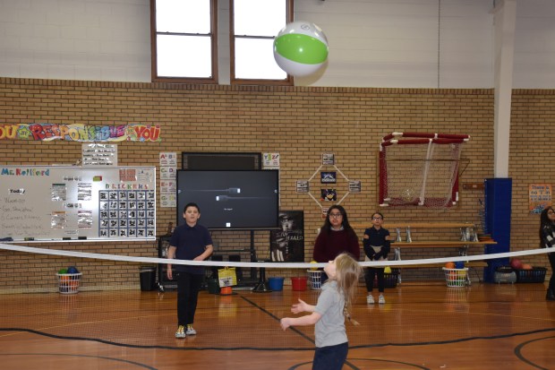 Third graders at Jackson Elementary School play beach volleyball during physical education with teacher Jioni Reliford class Friday, Feb. 24, 2023 in Greeley. Reliford, in his 10th year as a physical education teacher at Jackson, is also the school's wellness team leader and he's been instrumental in Jackson's participation in UCHealth's 5210+ Challenge, an 18-year-old program to help Colorado students, school staffs and families live healthier lives. (Anne Delaney/Staff Reporter)