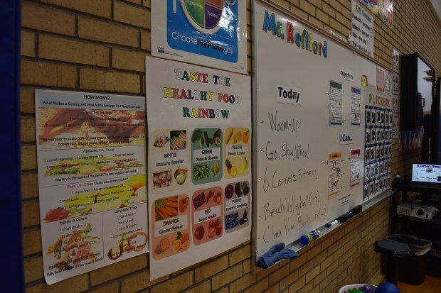 Reminders and tips on healthy eating are posted in the gymnasium at Jackson Elementary School in Greeley. Jioni Reliford, a physical education teacher at Jackson for the last 10 years, is also the school's wellness team leader and he's been instrumental in the school's participation in UCHealth's 5210+ Challenge, an 18-year-old program to help Colorado students, school staffs and families live healthier lives. (Anne Delaney/Staff Reporter)