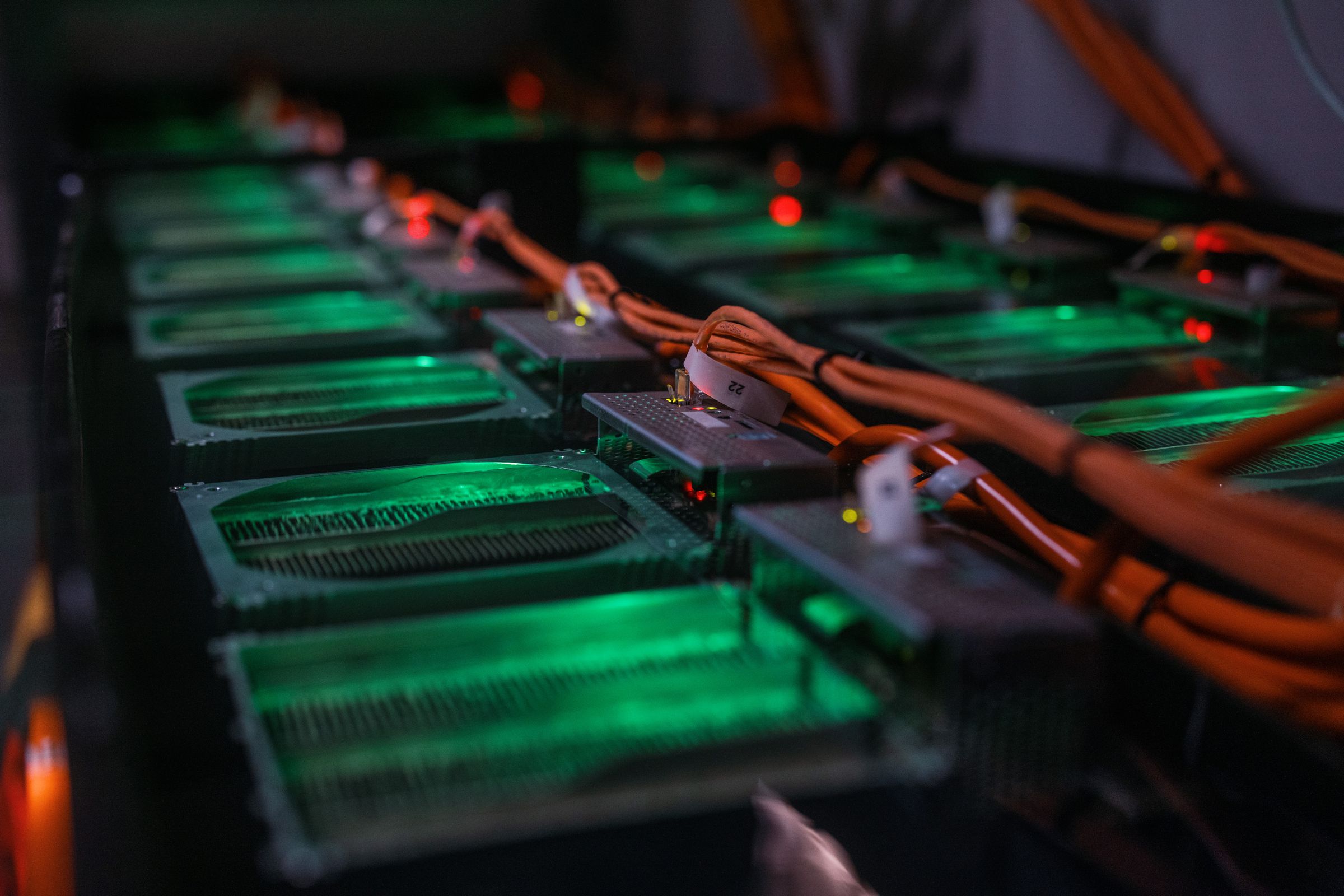 Close-up of computer hardware glowing green