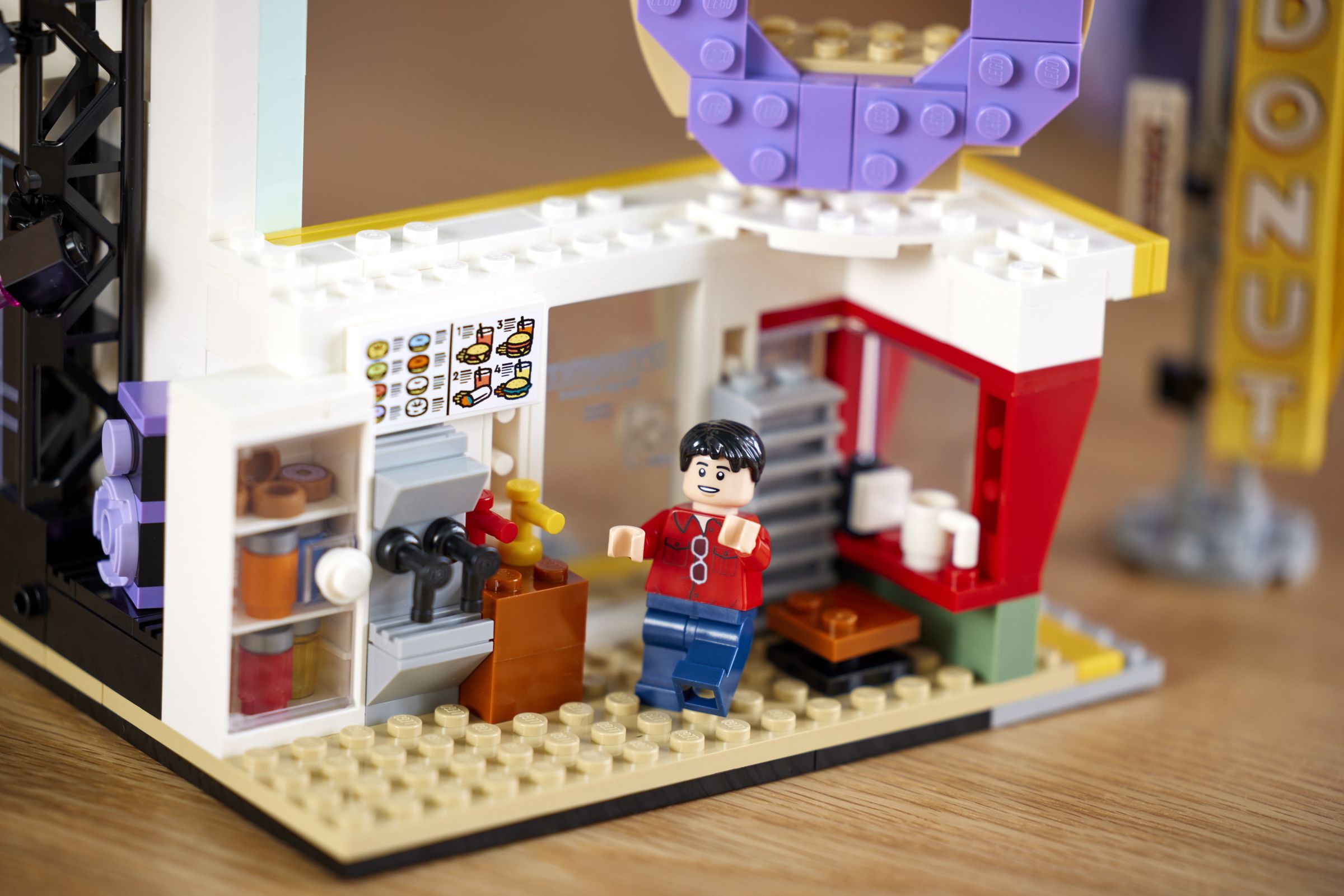 Lego J-Hope figurine in a Lego donut shop.