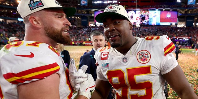 Travis Kelce, #87, and Chris Jones, #95 of the Kansas City Chiefs, celebrate after defeating the Philadelphia Eagles 38-35 in Super Bowl LVII at State Farm Stadium on Feb. 12, 2023 in Glendale, Arizona.