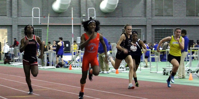 In this Feb. 7, 2019, file photo, Bloomfield High School transgender athlete Terry Miller, second from left, wins the final of the 55-meter dash over transgender athlete Andraya Yearwood, far left, and other runners in the Connecticut girls Class S indoor track meet at Hillhouse High School in New Haven, Conn.