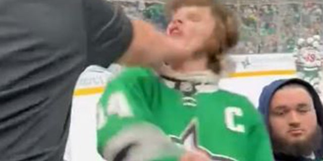 The Dallas Stars fan recoiled backward.