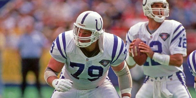 Indianapolis Colts offensive lineman Joe Staysniak, #79, blocks as quarterback Jim Harbaugh, #12, looks to pass against the Pittsburgh Steelers during a game at Three Rivers Stadium on Sept. 18, 1994 in Pittsburgh. The Steelers defeated the Colts 31-21. 