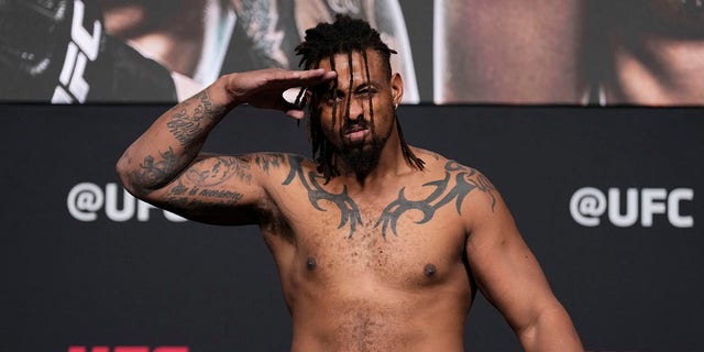 Greg Hardy poses on the scale during the UFC 272 official weigh-in at UFC APEX on March 4, 2022, in Las Vegas, Nevada.