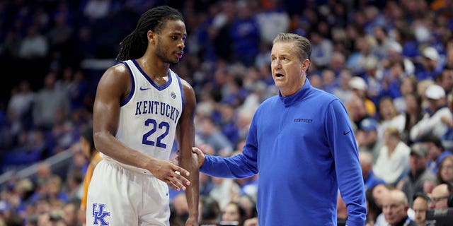 Cason Wallace #22 of the Kentucky Wildcats with John Calipari against the Tennessee Volunteers during the game at Rupp Arena on February 18, 2023, in Lexington, Kentucky.