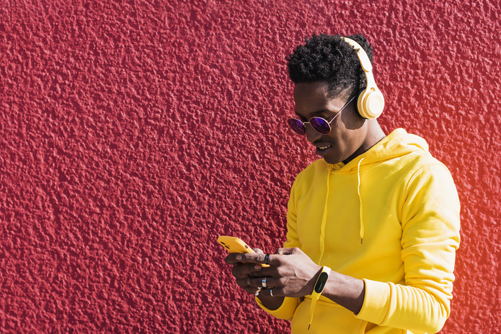 Young man listening music with headphones