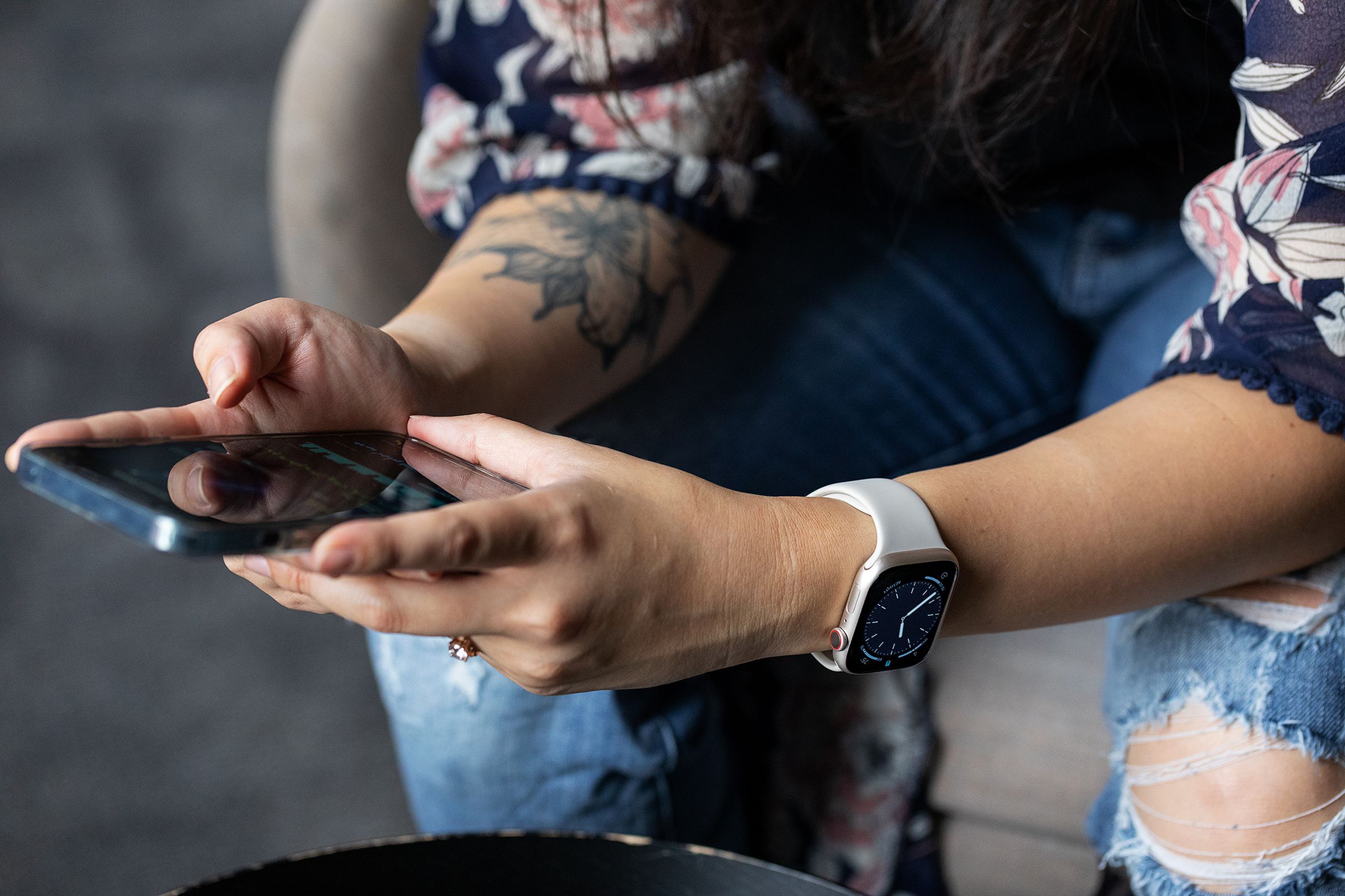 Woman wearing Series 8 while looking at a phone