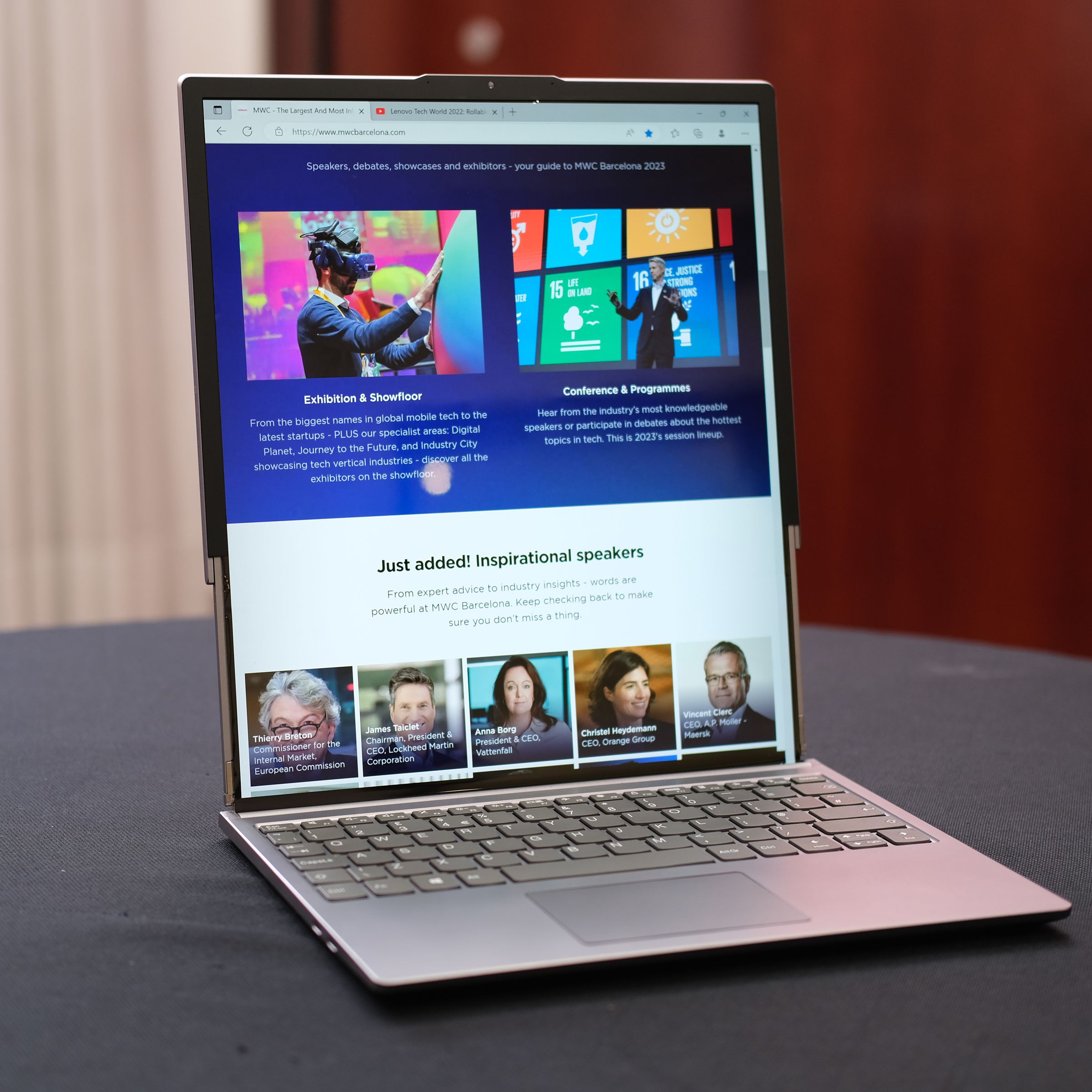 Lenovo’s rollable laptop concept sitting on a desk with its screen fully extended.