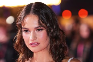 Lily James Oozes Glamour in a Corseted Figure-Hugging Dress and Wet-Look Hair