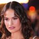 Lily James Oozes Glamour in a Corseted Figure-Hugging Dress and Wet-Look Hair