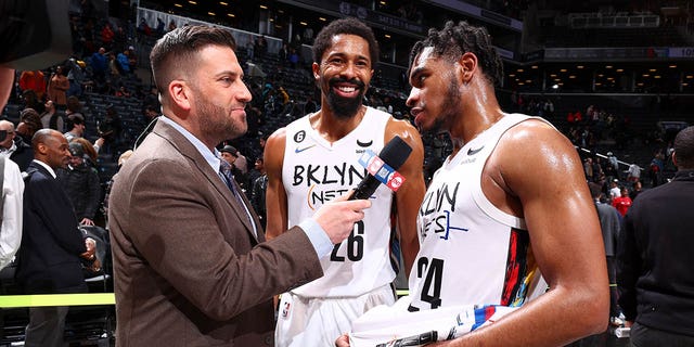 The Brooklyn Nets' Cam Thomas, right, is interviewed after the game against the Chicago Bulls at Barclays Center in New York City on Thursday.