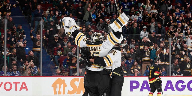 Linus Ullmark of the Boston Bruins scores a goalie goal on a pulled net during the final seconds of their win over the Vancouver Canucks at Rogers Arena February 25, 2023, in Vancouver, British Columbia, Canada.