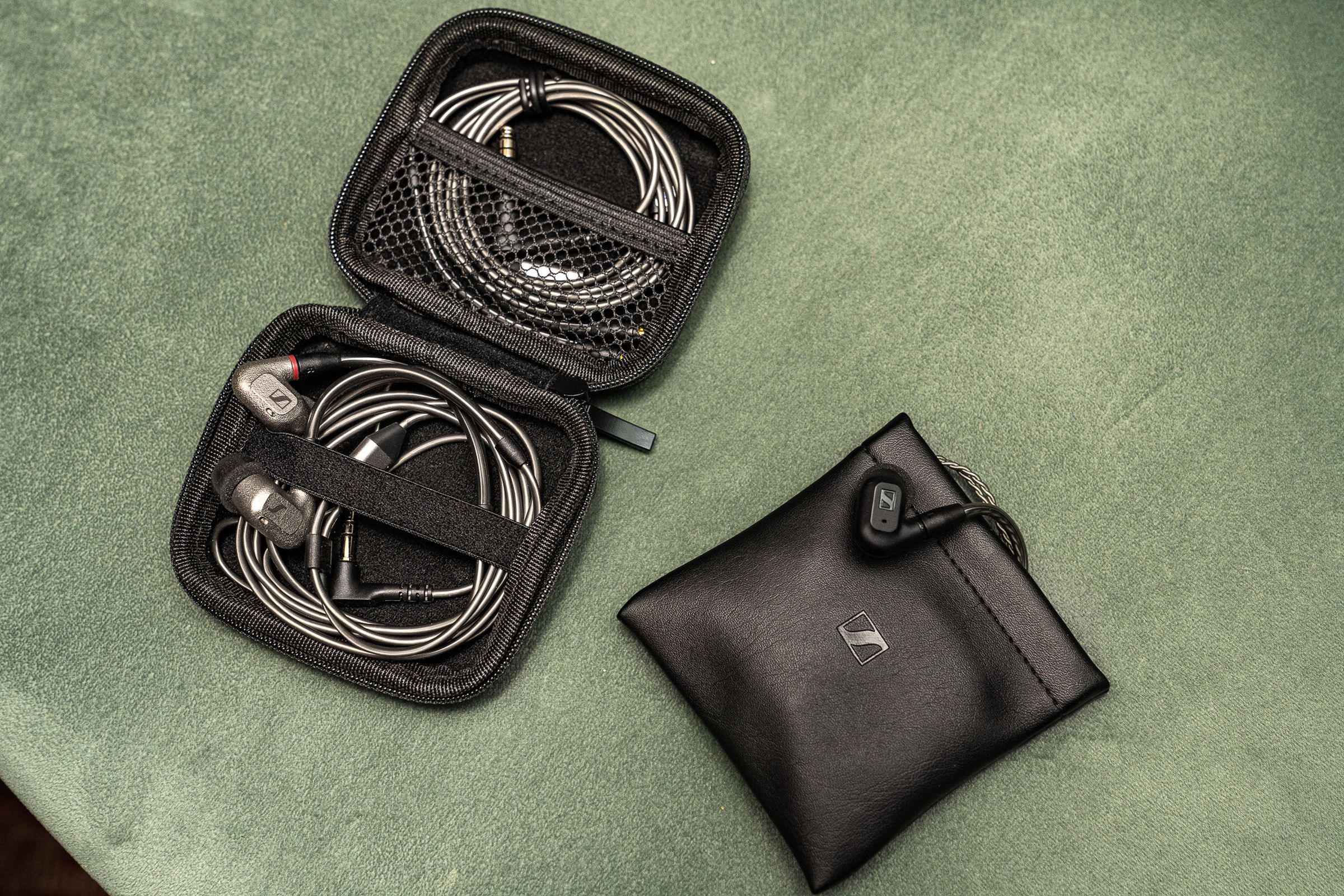 A photo comparing the cases of Sennheiser’s IE 200 and IE 600 earbuds.