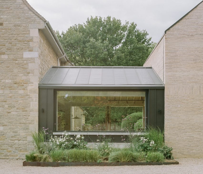 Zinc-clad extension by Studio McW at stone home in Cambridgeshire