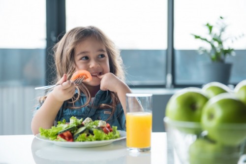 stock photo of a child eating