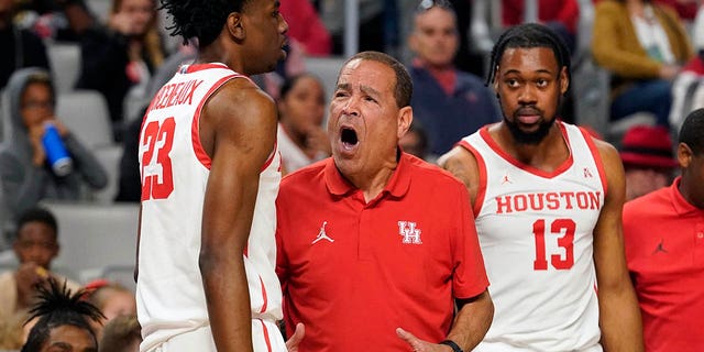 Houston head coach Kelvin Sampson, center, yells at guard Terrance Arceneaux (23) as forward J'Wan Roberts (13) looks on during the first half against Memphis in the finals of the American Athletic Conference Tournament, Sunday, March 12, 2023, in Fort Worth, Texas.